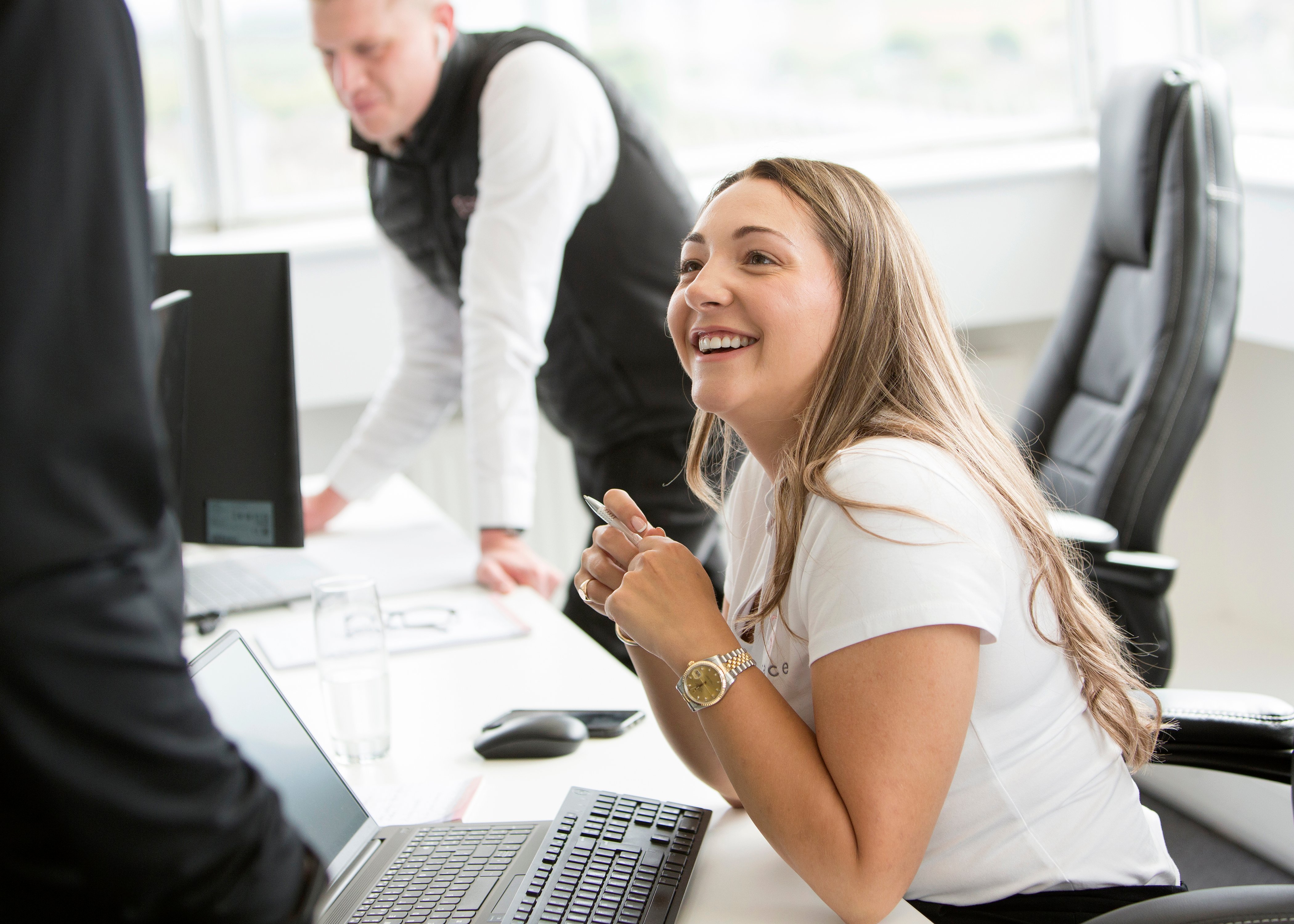 Sarah Sheeran smiling at her desk