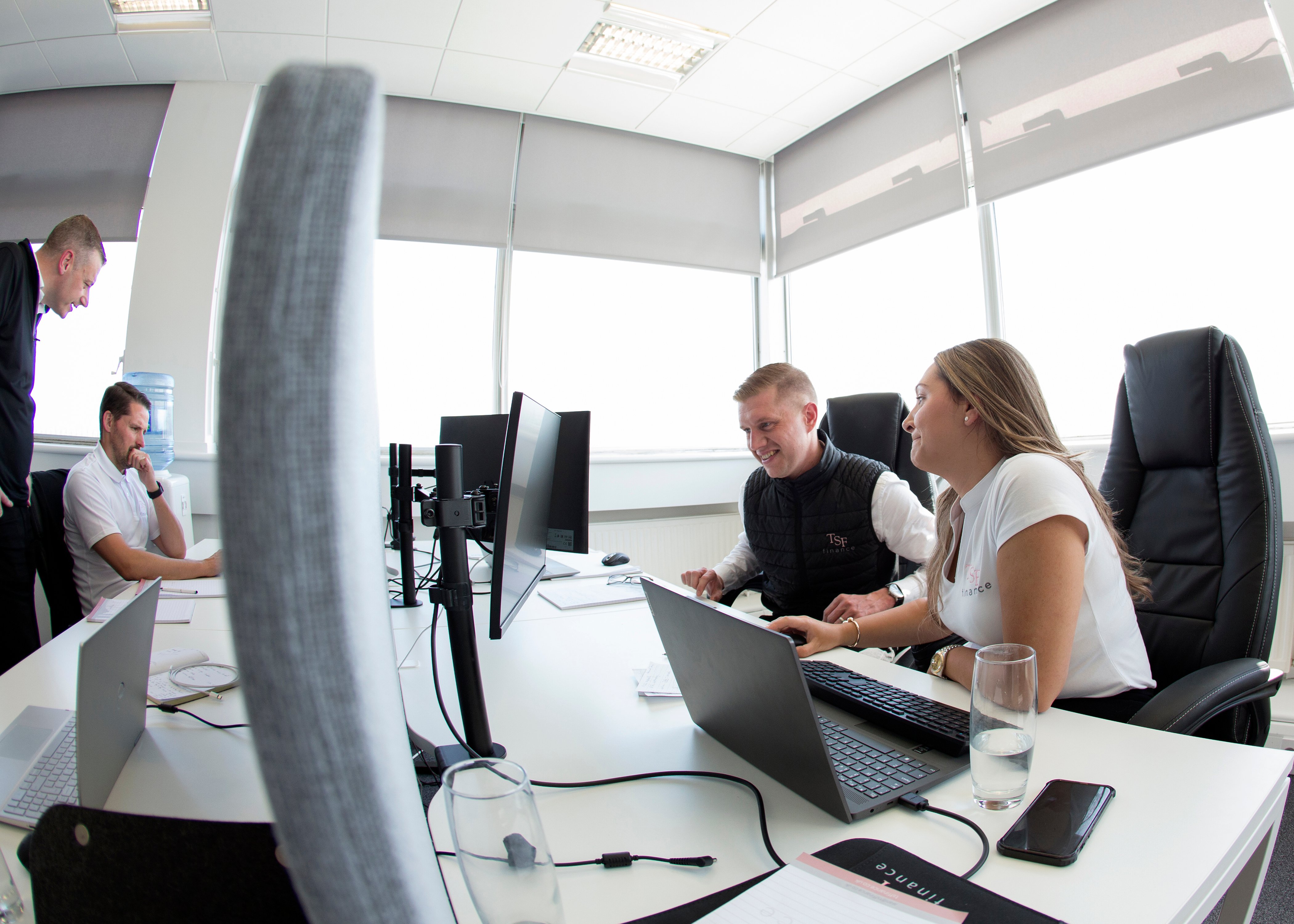 Team working around a computer