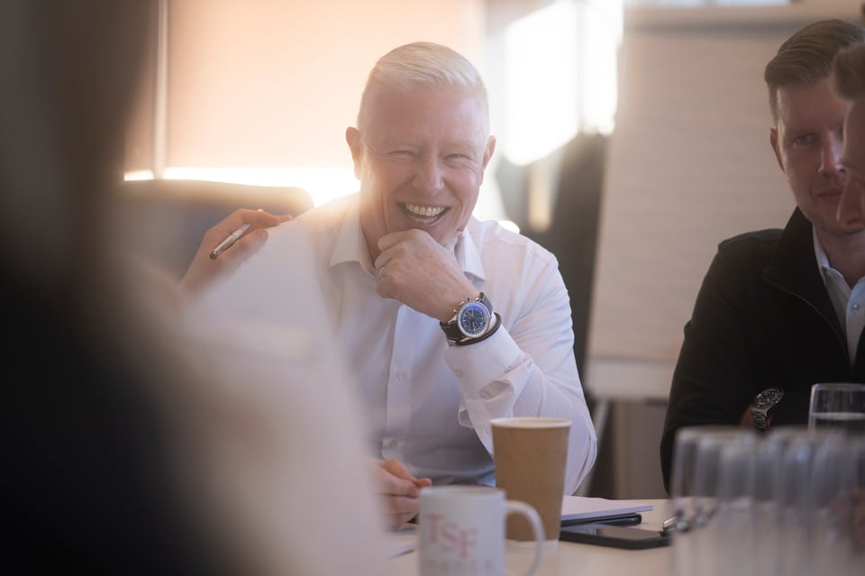 Stephen smiling at his desk