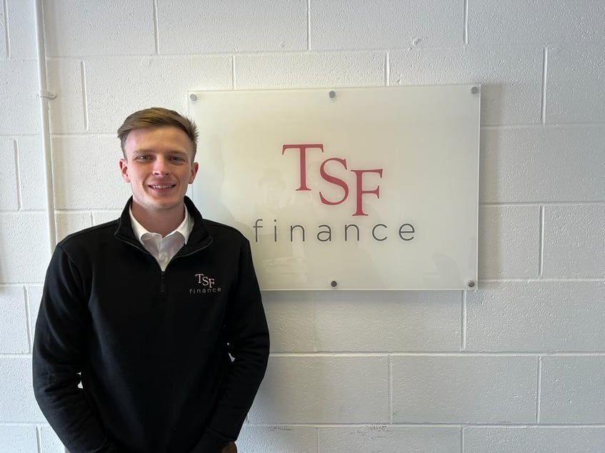 Conor Smyth standing in front of TSF logo