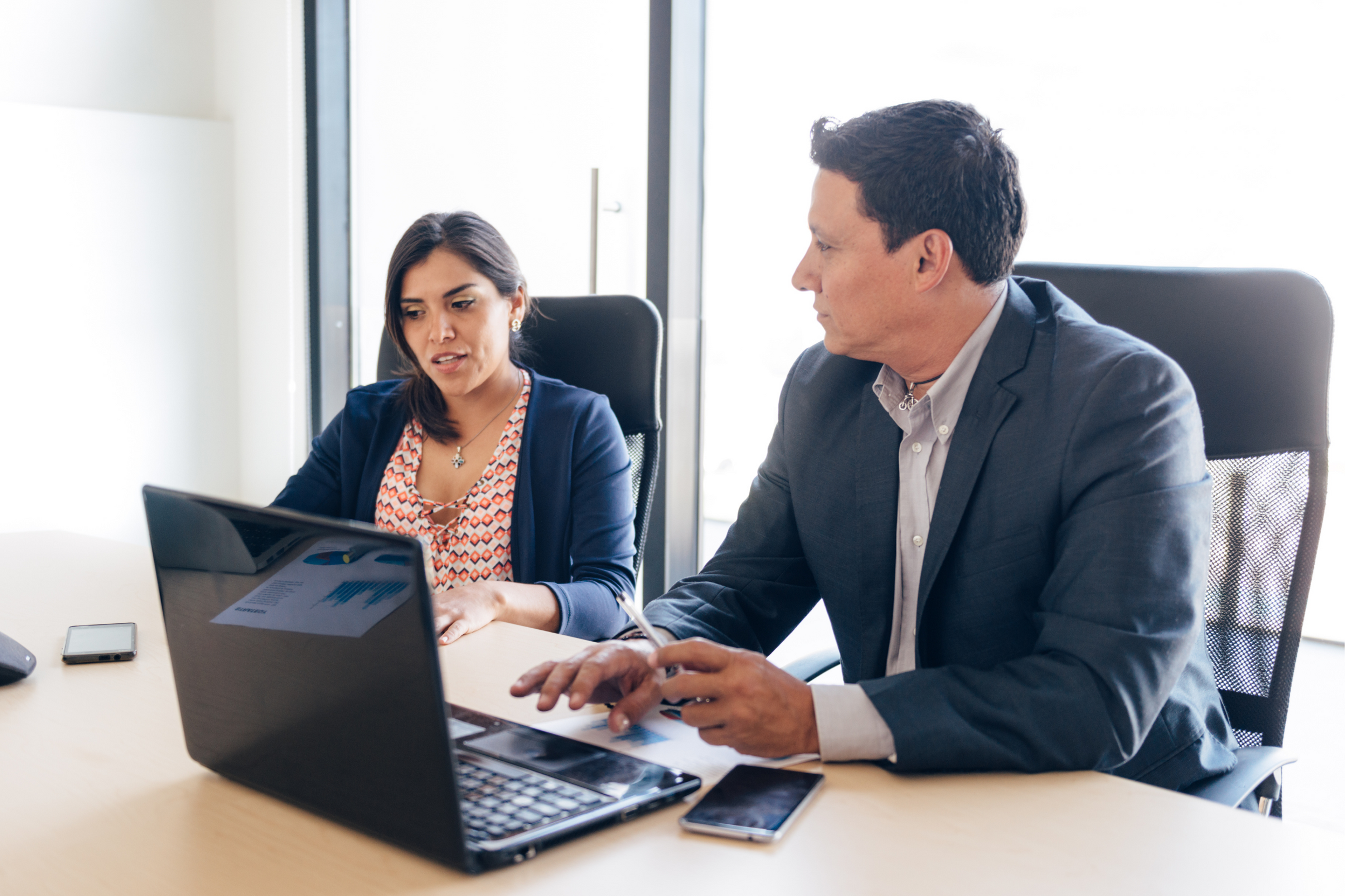 A man and a woman talking about refinancing.