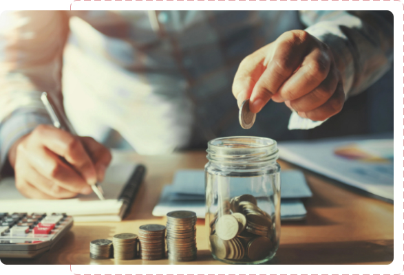 Someone putting coins into a jar.